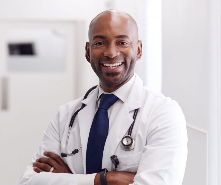 portrait-of-mature-male-doctor-wearing-white-coat-H49URGD-1.jpg